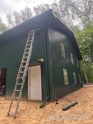 Barn Bosses Tramp House Gutter Downspout Installation Service Project in Ludington MI 49431